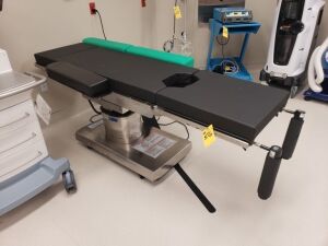 2019 Steris 4085 Surgical Table w/Stainless Steel Covers, s/n 0406419161 w/Stryker Automatic High Vacuum Pump & Candy Cane Stir-Ups